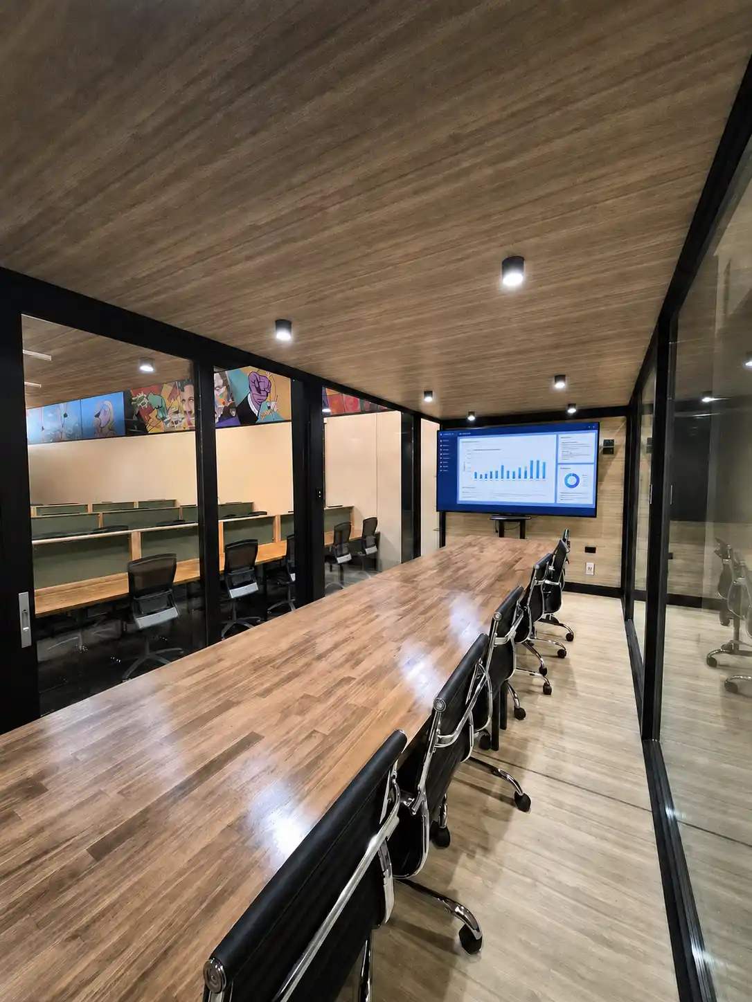 Private meeting room within the DeskPlex Executive Headquarters in Hawthorn, featuring a large boardroom table, seating and presentation screen for team meetings, presentations and executive discussions