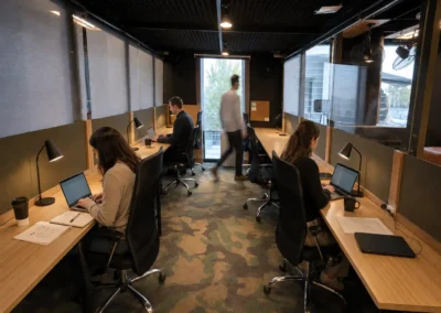 Dedicated desks at DeskPlex Hawthorn coworking space with individual workstations and ergonomic chairs