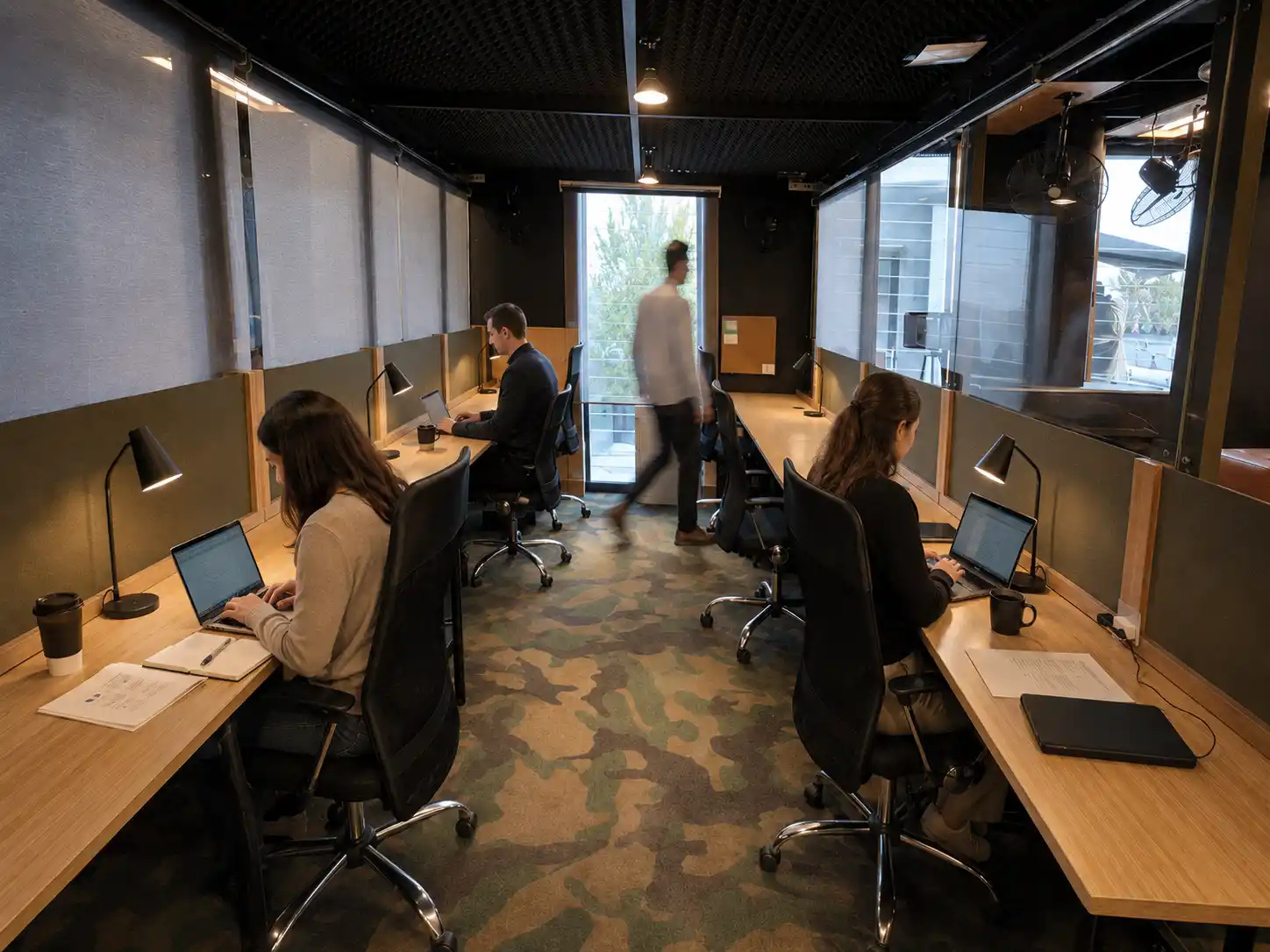 Dedicated desks at DeskPlex Hawthorn coworking space with individual workstations and ergonomic chairs