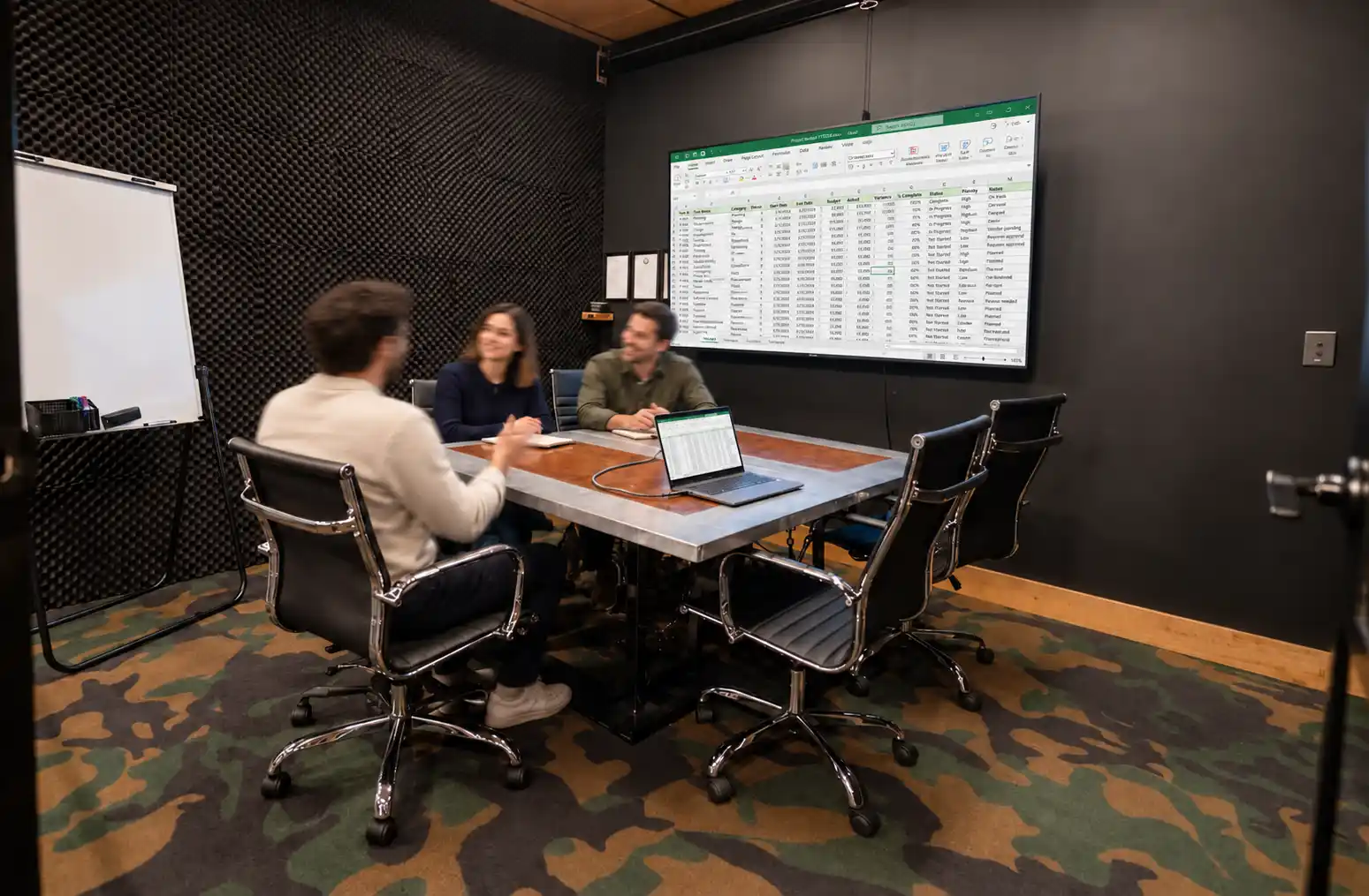 Fully equipped team meeting room at DeskPlex Hawthorn with a presentation screen, whiteboard and conference seating for collaborative meetings, project planning and business discussions.